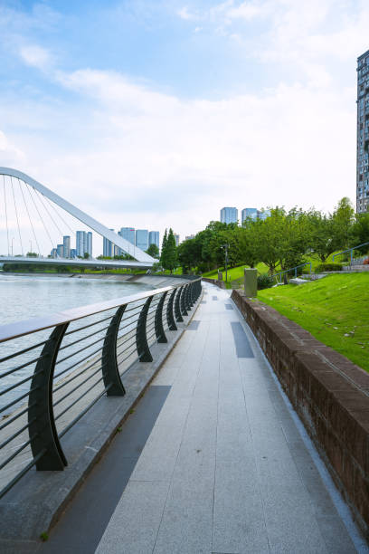 istock Sunny riverside bridge and Financial City 1405699277