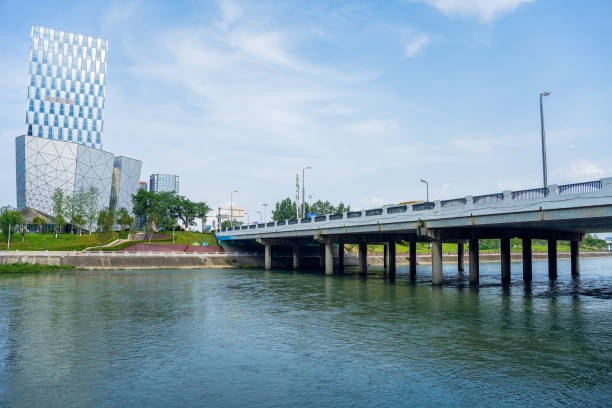 istock Sunny riverside bridge and Financial City 1405699882