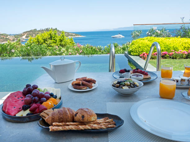 istock Summer breakfast with fresh fruits and bakes 1405705385