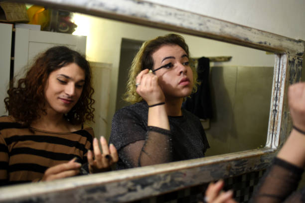 istock friends putting on makeup in the mirror 1405706988