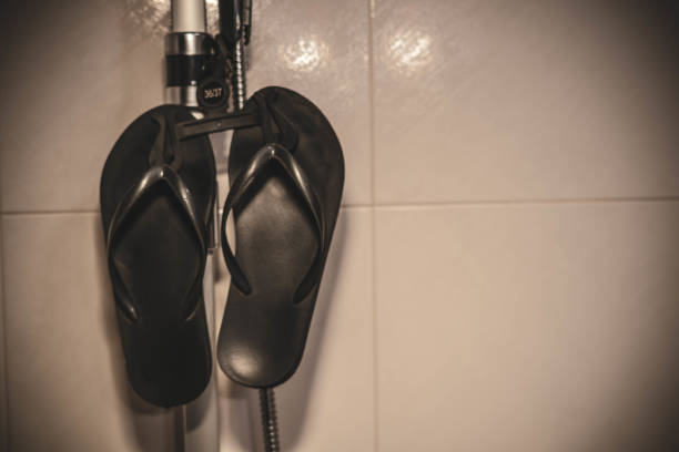 istock flip-flops in the shower 1405708579