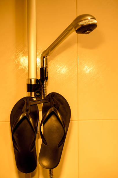 istock flip-flops in the shower 1405708580