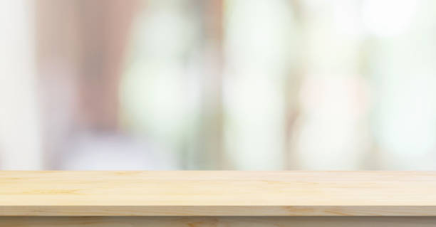 istock Empty wood table top with cafe restaurant interior blurred background 1405709383