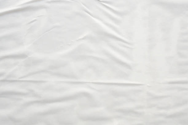 istock white crumpled and creased paper poster texture background 1405709429