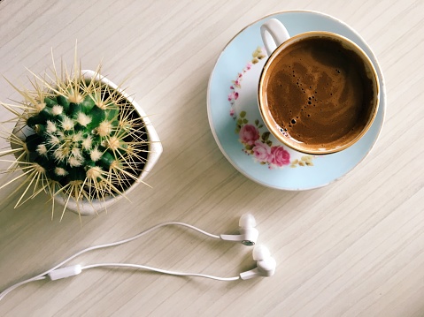 Turkish coffee with cactus. Headphone. Cactus and Turkish coffee.