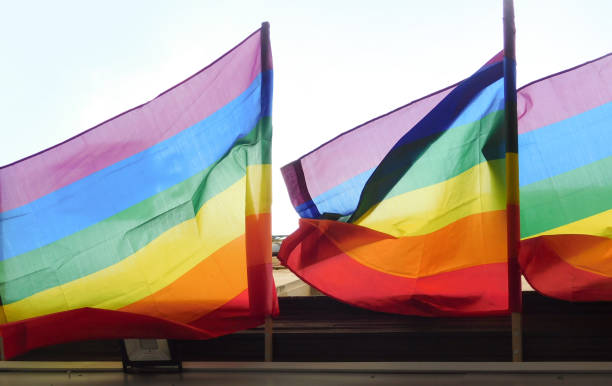 istock Pride rainbow lgbt gay flag being waved on sky background 1405714313