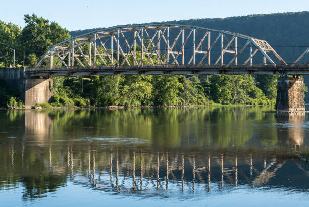 istock The Tidioute Bridge and it's reflection beneath it on the Allegheny River in Tidioute, Pennsylvania, USA 1405716152