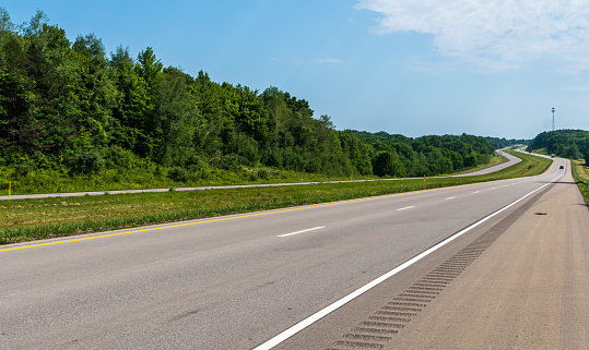 The divided four lane State Route 8 in Venango County, Pennsylvania, USA on a sunny summer day