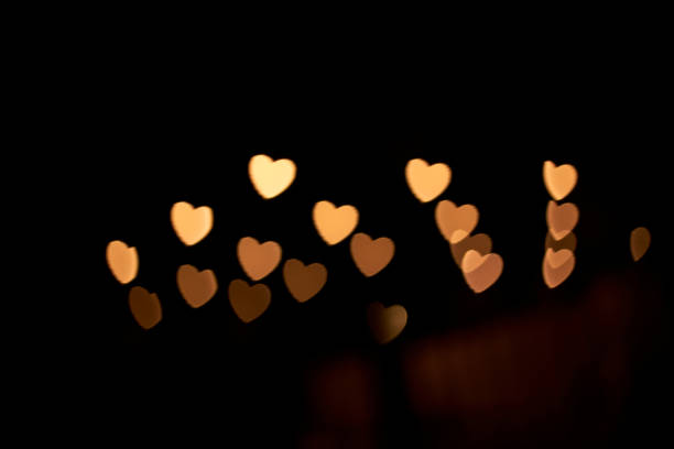 istock Heart-shaped light spot in the dark night 1405721398