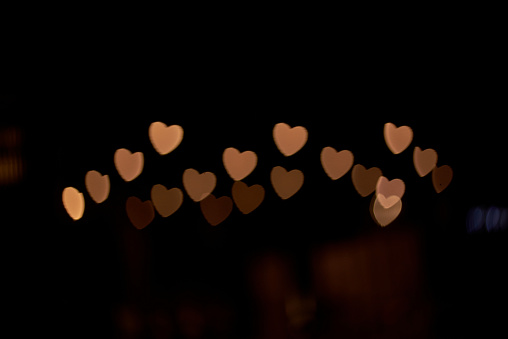 Heart-shaped light spot in the dark night