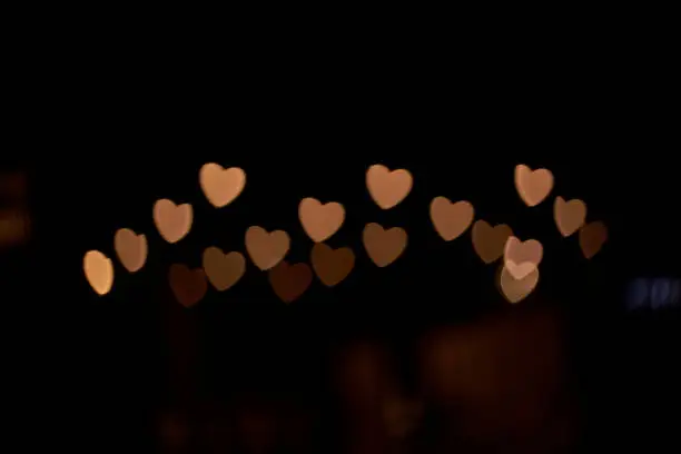 Heart-shaped light spot in the dark night