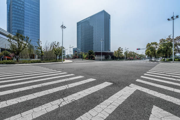 istock empty road with zebra crossing and skyscrapers in modern city 1405722272