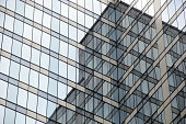 istock Exterior perspective glass windows in office buildings 1405726274
