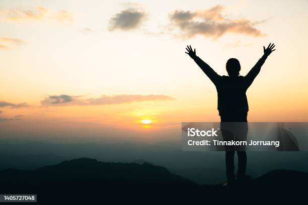 Silhouette Of A Woman Praying On The Mountain Praying Hands With Faith In Religion And Belief In God Stock Photo - Download Image Now