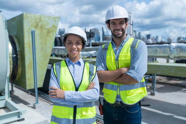 istock Engineer under checking the industry chilled water fan coil unit air conditioner is water cooling tower air chiller HVAC system of large industrial building to control air system 1405728075
