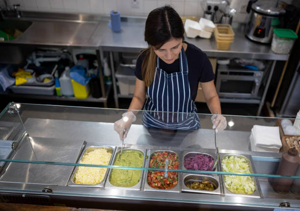 istock Woman working at a Mexican restaurant 1405734549