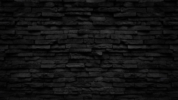istock Old black stone brick wall texture for background or tiles floor decorative design. 1405734889