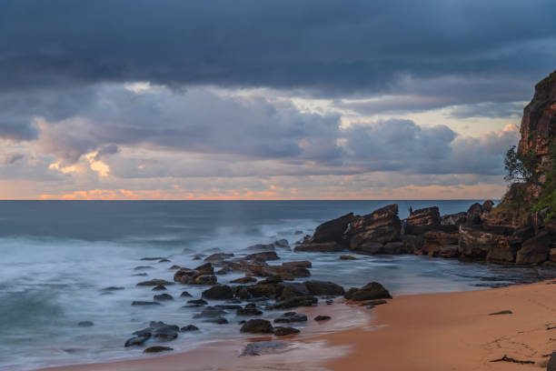 istock Dawn seascape with rain clouds 1405735884