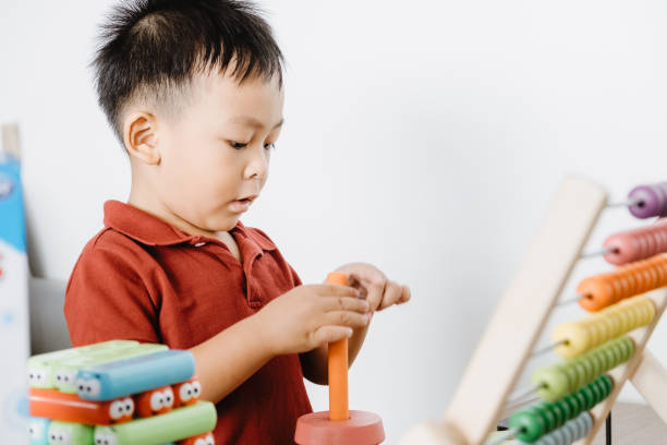 istock Cute little Asian baby boy learning educational 1405738080