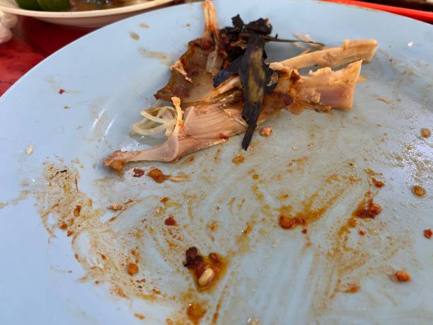 istock Leftover food . Dinner eating at restaurant, Sting ray leftover on plate. 1405739512