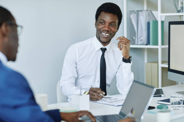 istock Smiling Black Businessman Discussing Project 1405739575