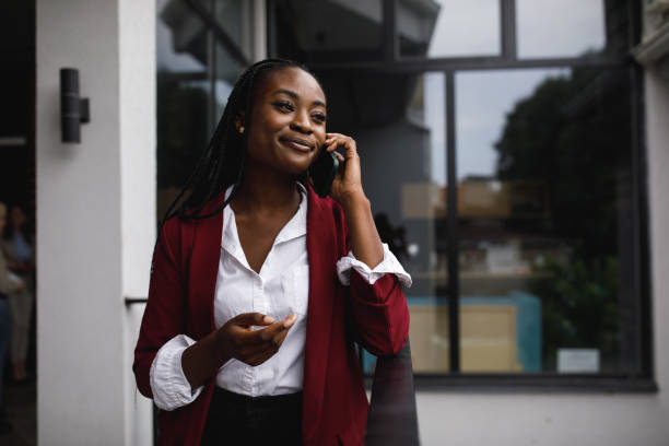 istock Smiling young businesswoman gesturing during a conference call 1405741691
