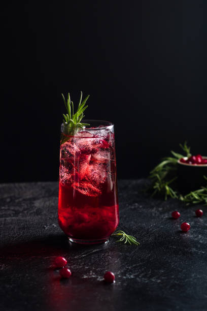 istock Iced cranberry drink garnished with rosemary. 1405742356