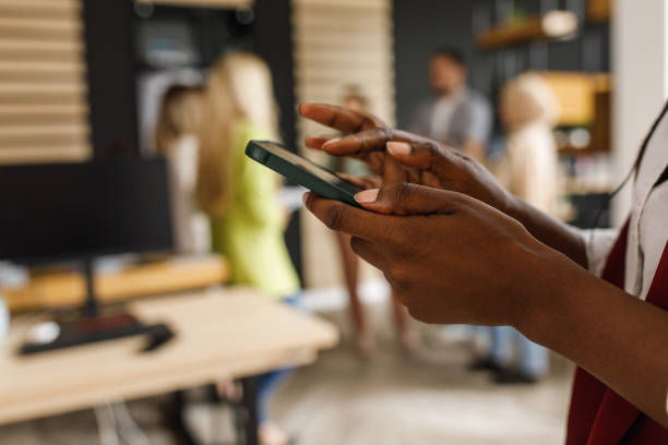 istock Businesswoman scrolling through social media on smart phone on a work break 1405748943