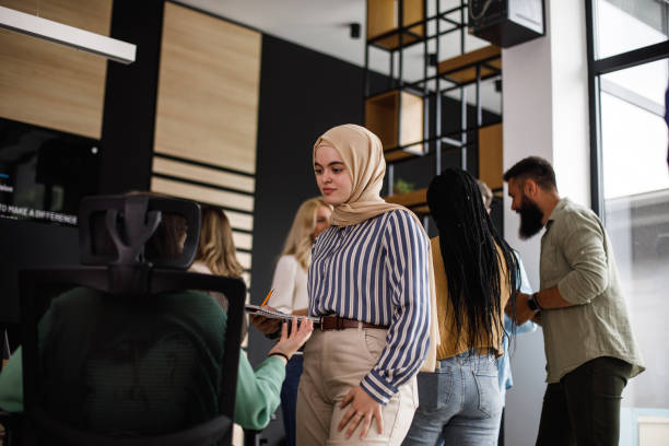 istock Business people having briefings regarding mutual projects in a co-working office space 1405749053