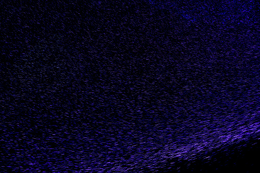 Abstract sparkling purple background.light particles