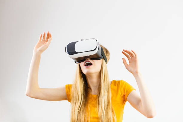 istock Girl wearing virtual reality goggles. 1405752944