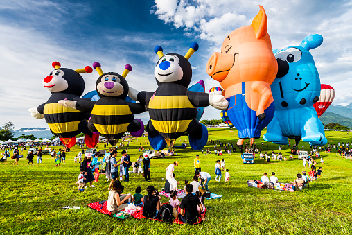 Taitung, Taiwan- July 6, 2019: Tourists are visiting the Taiwan international balloon festival at Luye highland in Taitung.