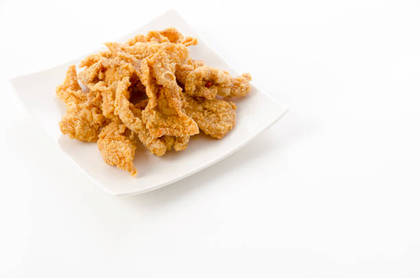 istock Crispy Fried Chicken Skin on plate 1405753433