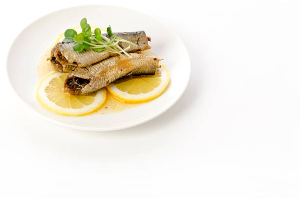 istock Sardines with slice lemon on a white plate 1405753735