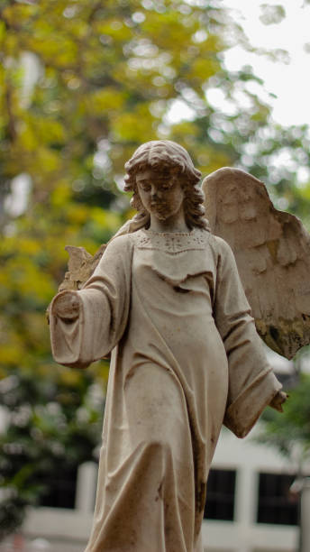 istock angel sculpture with one arm and wings 1405756094