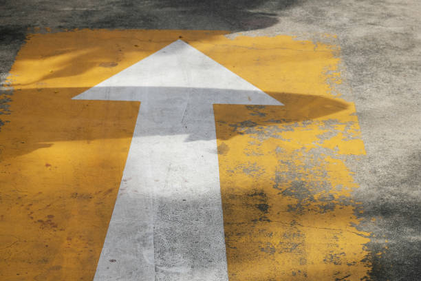 istock arrow sign on old road 1405757158
