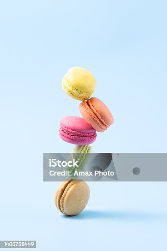 istock Confectionery, macaroons balance over blue background 1405758449