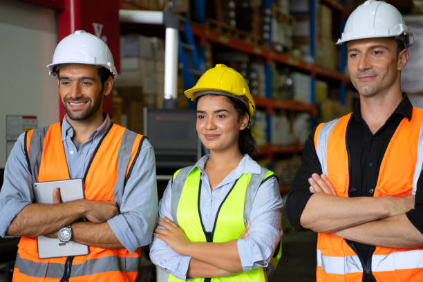 istock Blue collar worker with co worker at factory. 1405758885