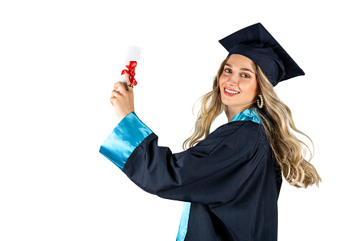 Graduation portrait of beautiful blonde woman with cap and gown isolated on white background