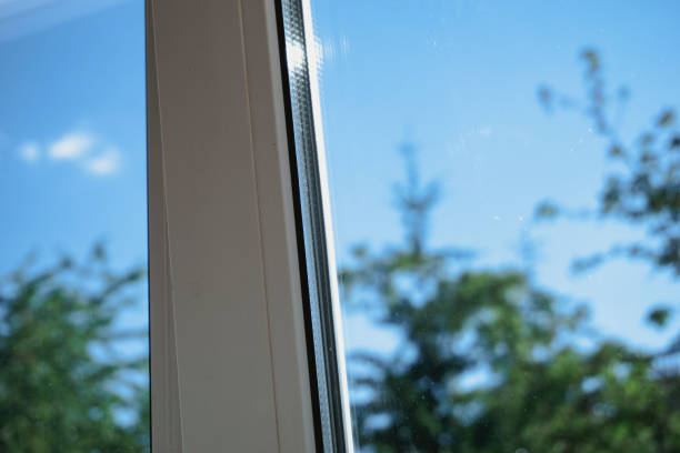 istock Window on a background of sky and green trees. 1405769695