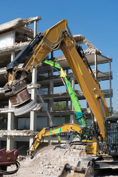 istock excavators demolishing a skyscraper 1405771216