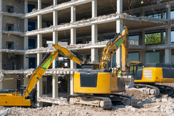 Demolition of a large parking garage - heavy machinery,