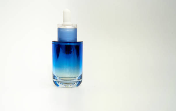 istock cosmetic dropper cap bottle on white 1405772632