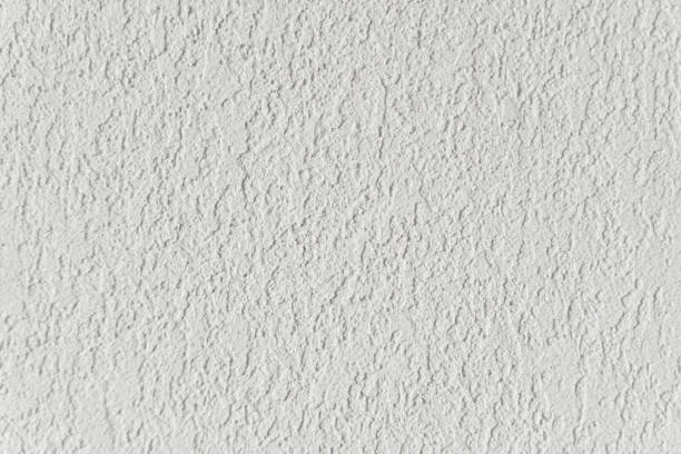istock White wall with plaster background. Plaster and putty grain surface texture. Finishing, decor concept. 1405772870