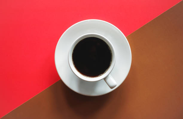 istock Cup of black coffee on abstract red and brown background 1405773613