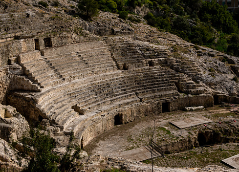 ancient roman amphitheater, historical ruins ancient arena or theatre in the city of Cagliari in Sardinia - Italy
