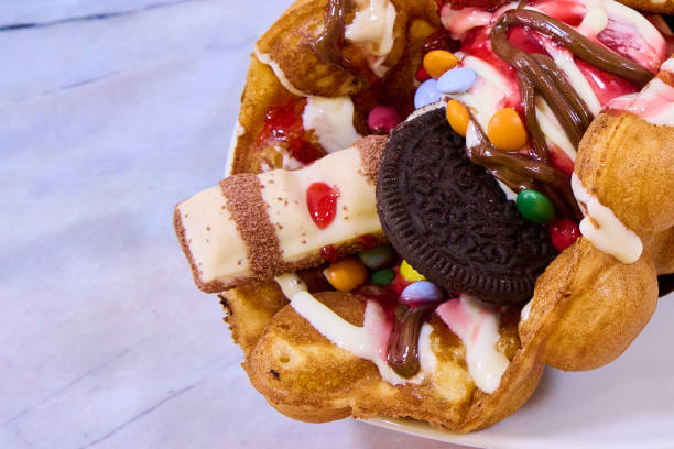 istock waffle with chocolate, ice cream, strawberry sauce and sweets 1405781554