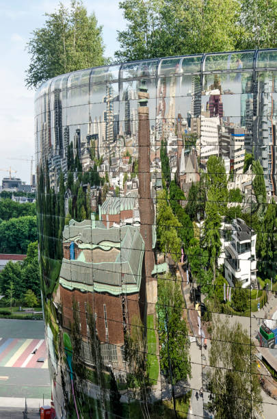 Rotterdam, The Netherlands, June 24, 2022: museum Boymans and the surrounding city reflecting in the mirror facade of the Depot building