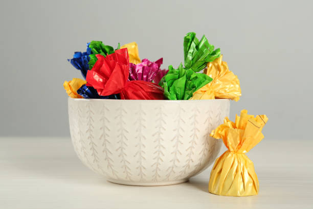 istock Candies in colorful wrappers on light table 1405781967