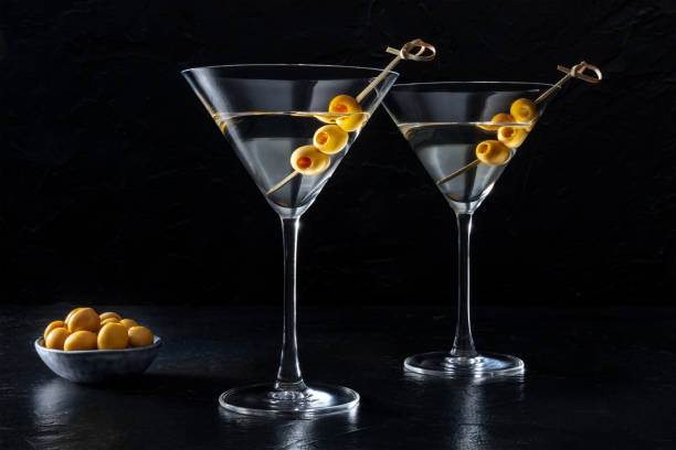 istock Martini, two glasses with spicy olives, on a dark background 1405785487
